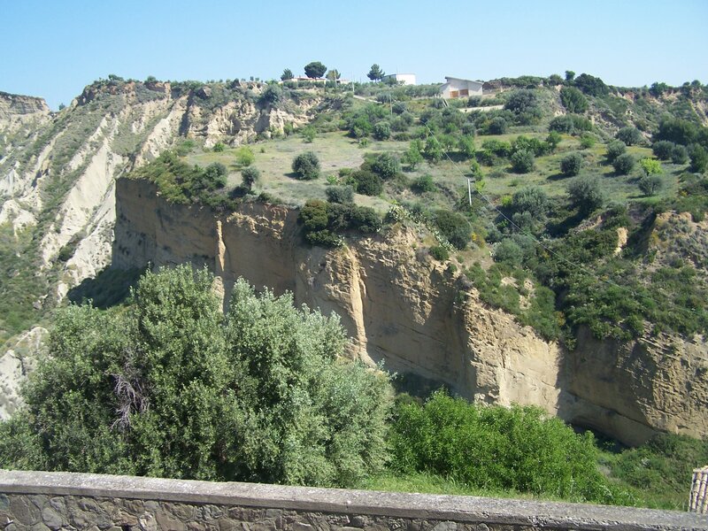 cliffside village under blue sky