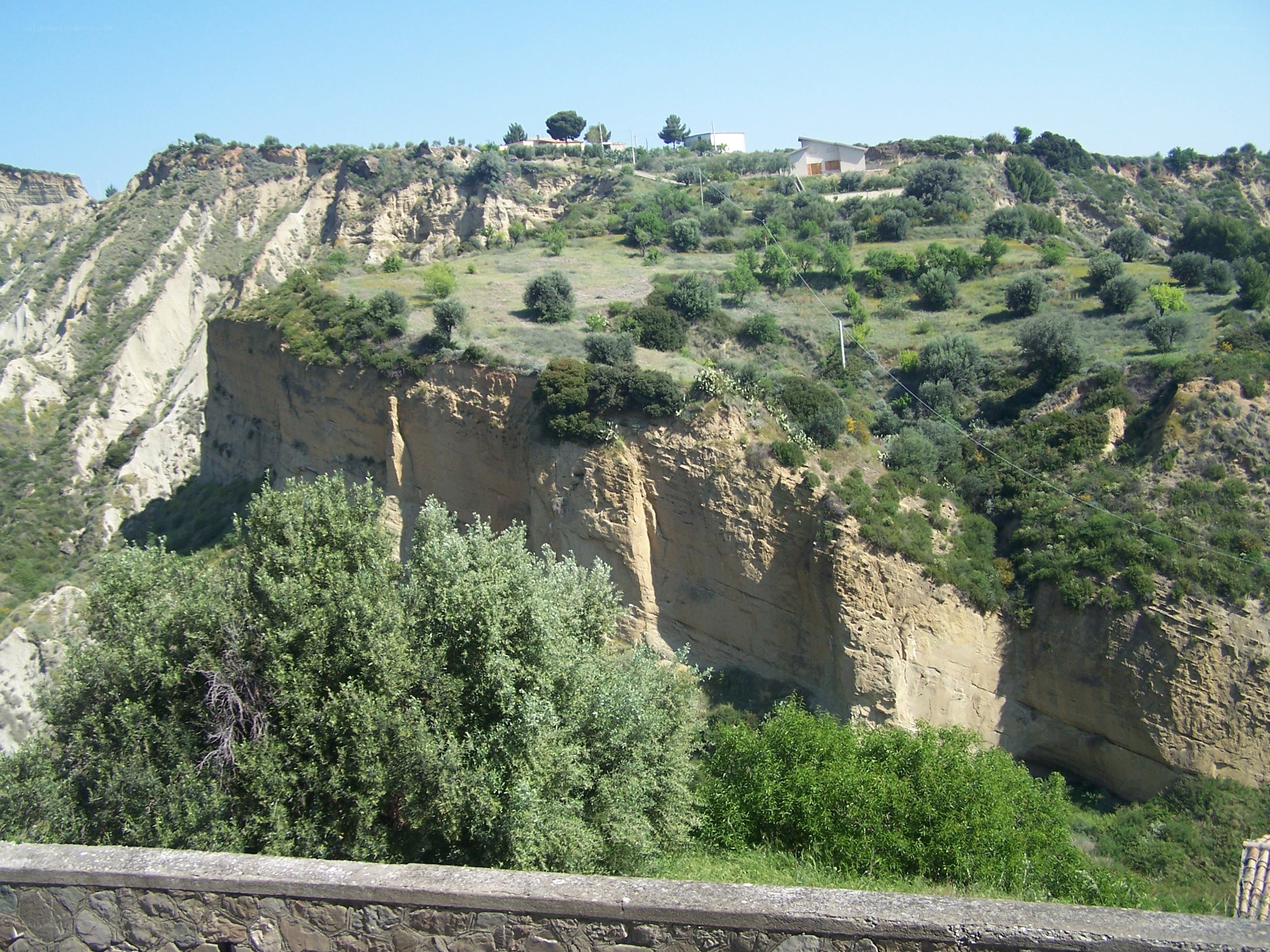 cliffside village under blue sky