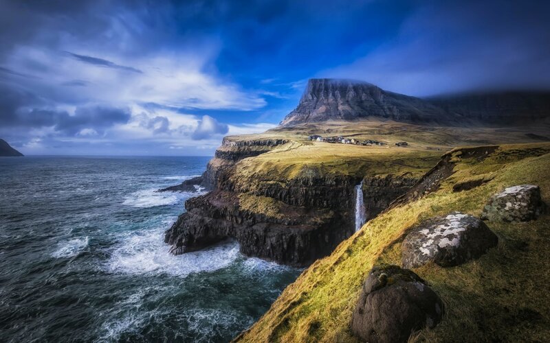 Cliffside Waterfall Village — Blue, Dramatic