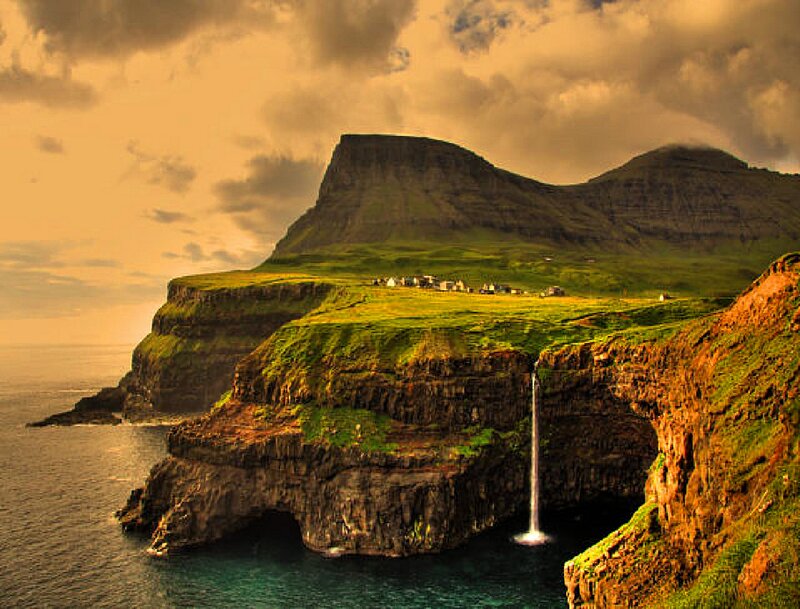 Cliffside Waterfall Village — Green, Dramatic