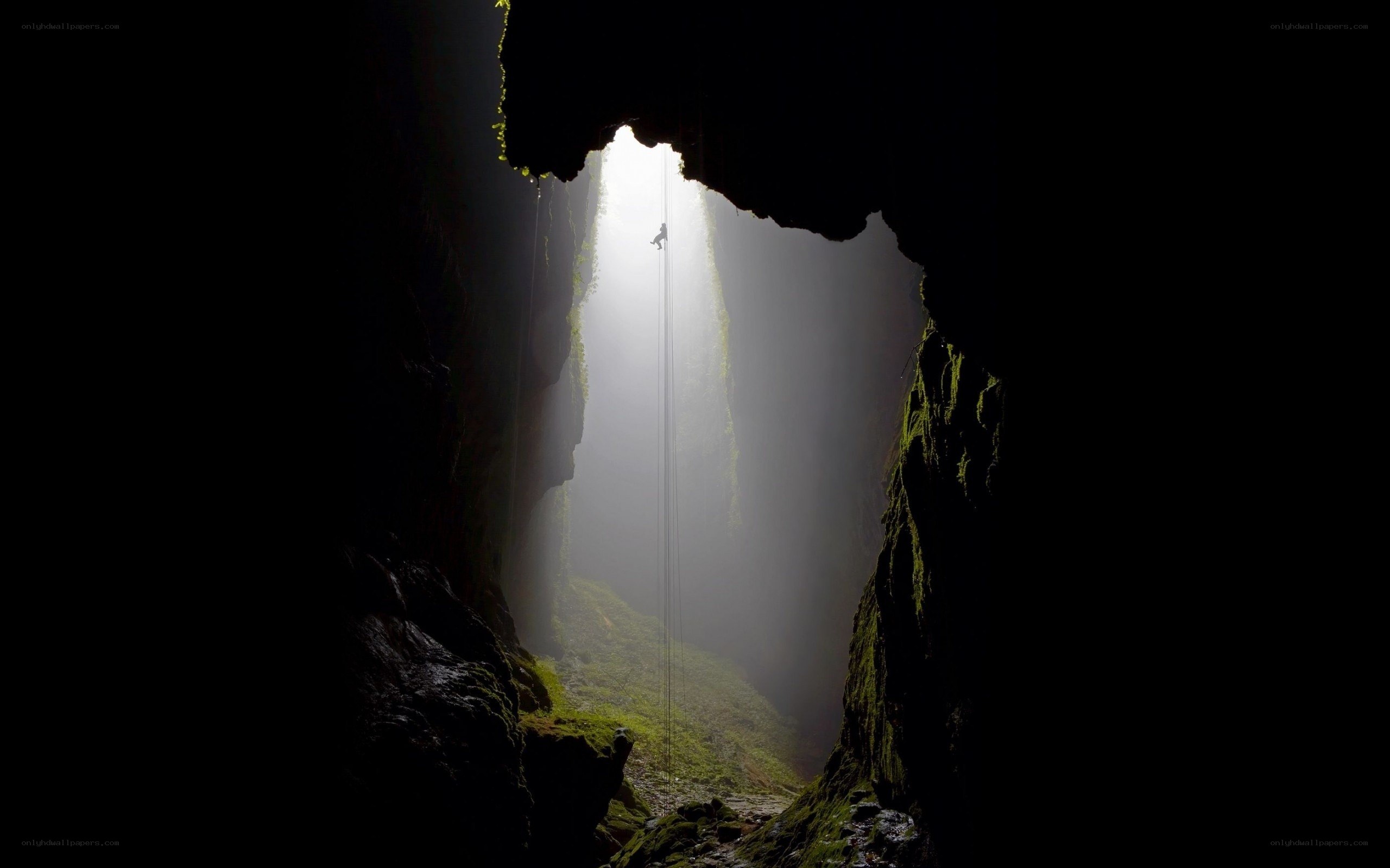 Climber in a deep cave