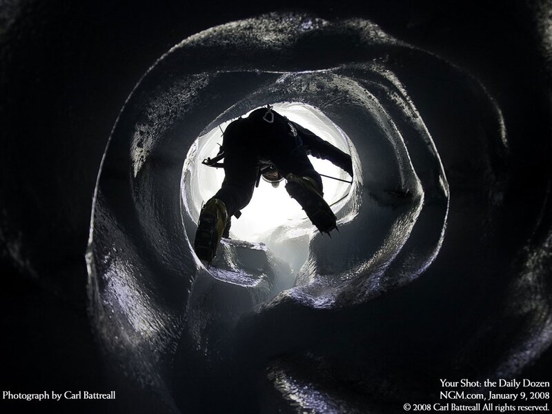 Climber in ice tunnel