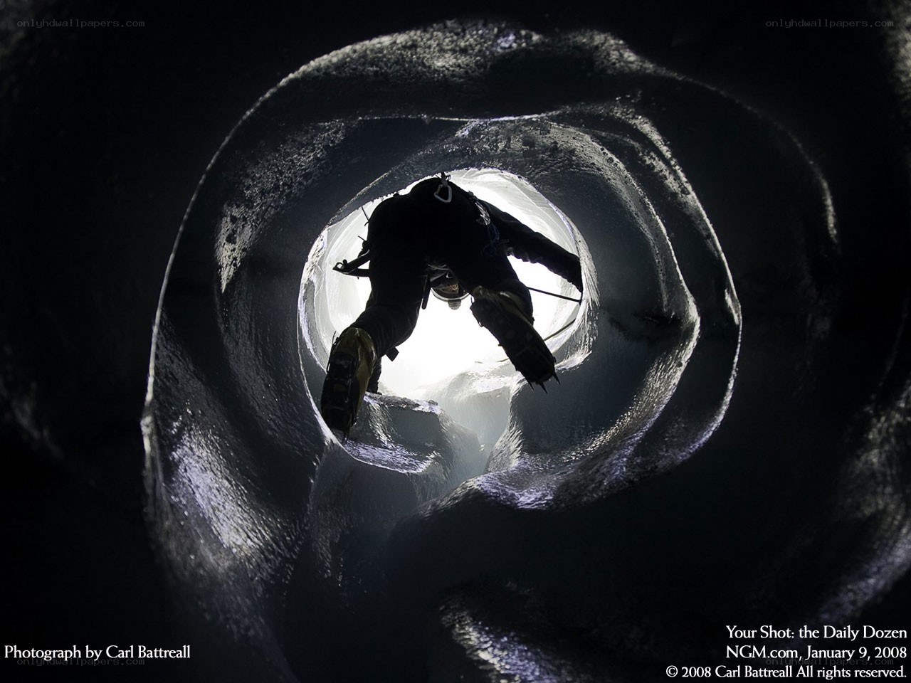 Climber in ice tunnel