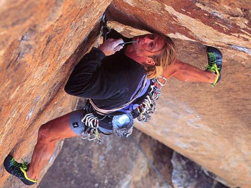 climber in rock crevice