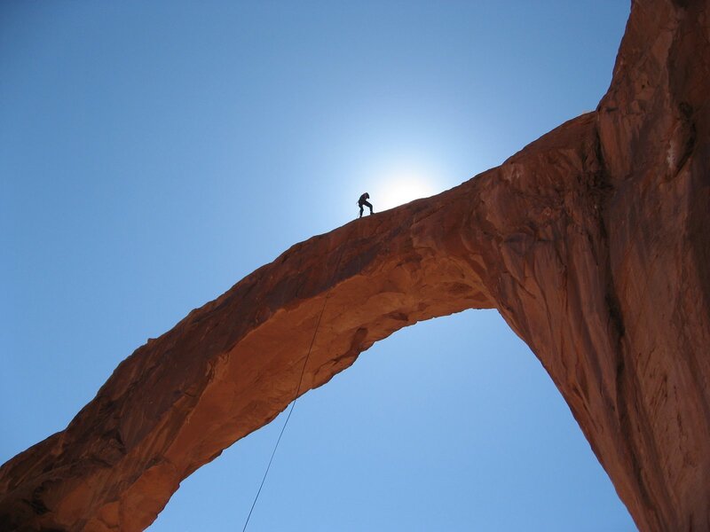 Climber on a natural arch