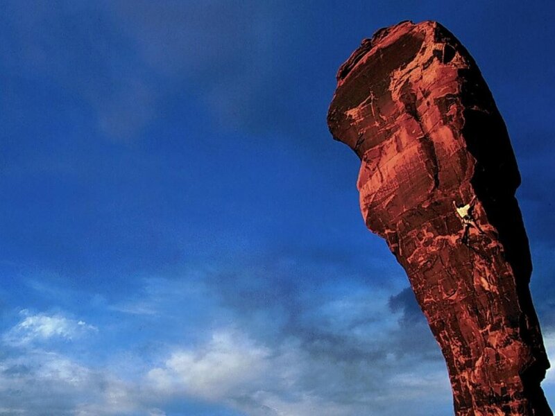 Climber on a red rock formation