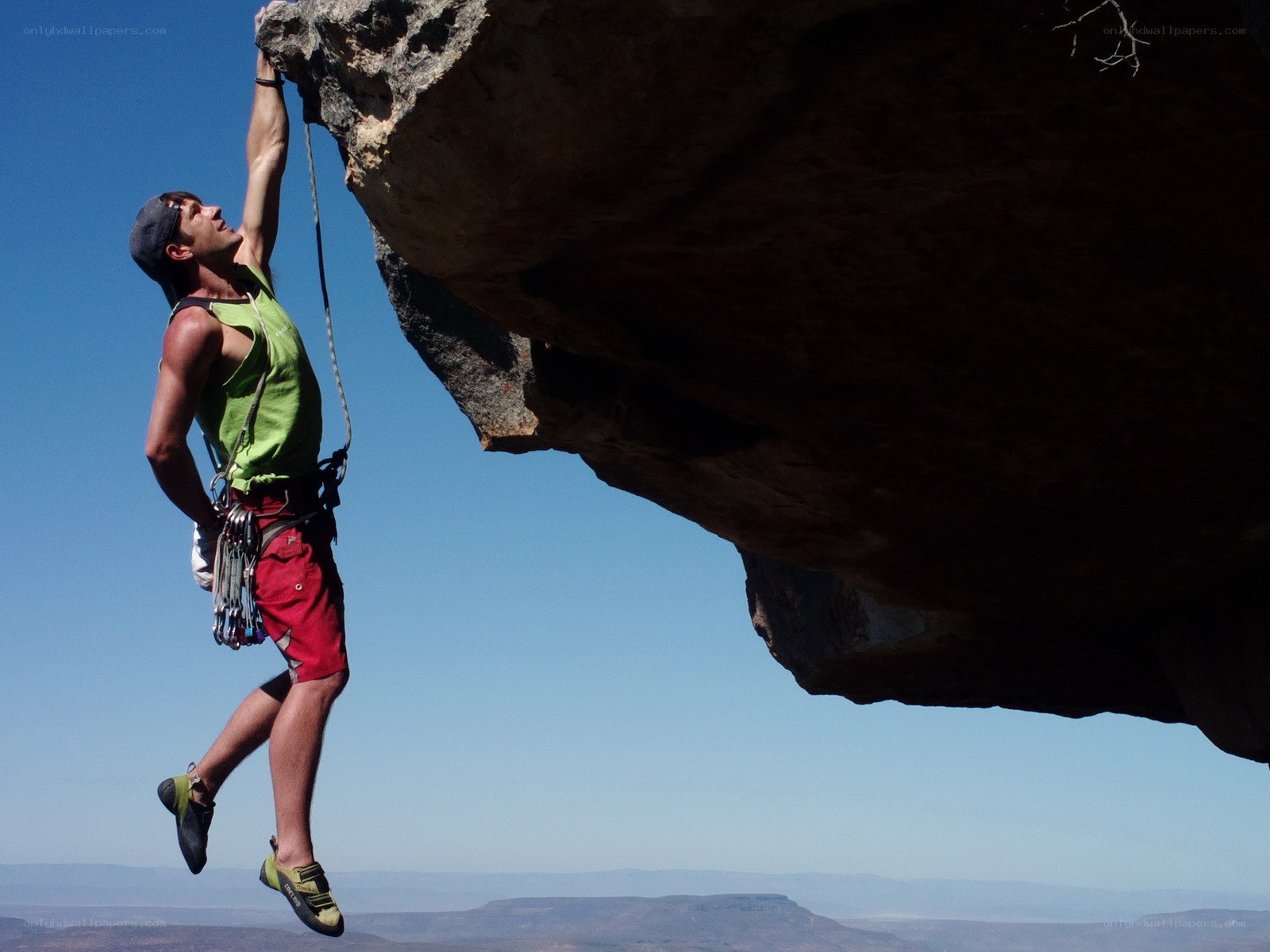 Climber on a rock overhang