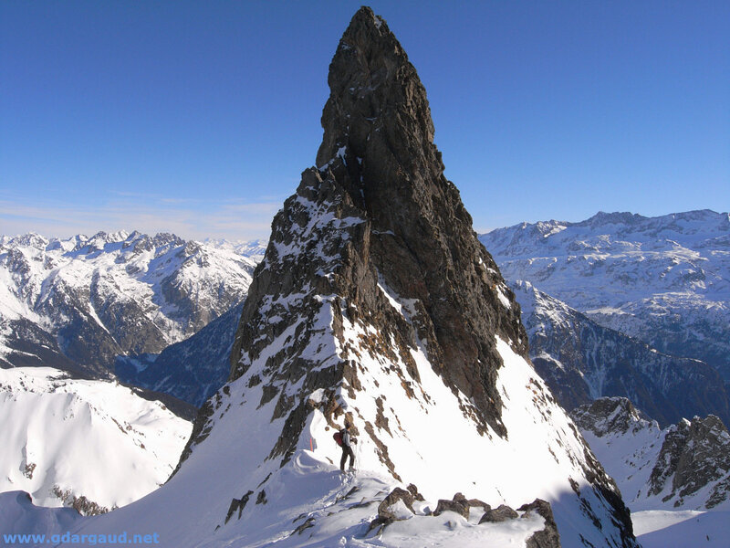 Climber on a snowy mountain peak