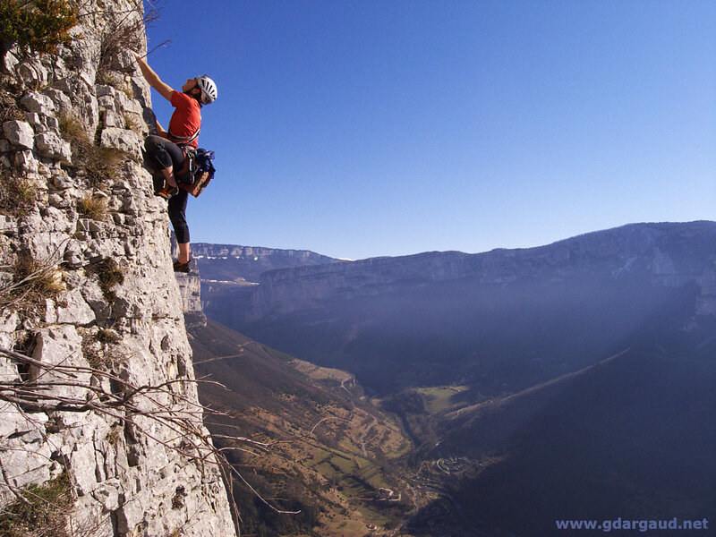 Climber on a steep cliff