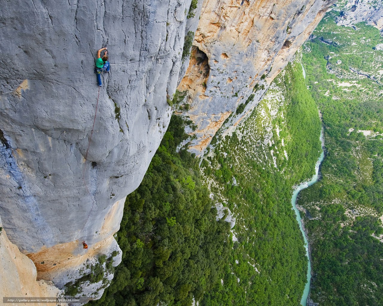 Climber on a steep cliff
