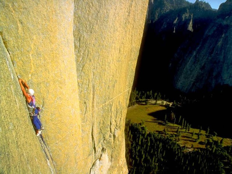 Climber on a steep rock face