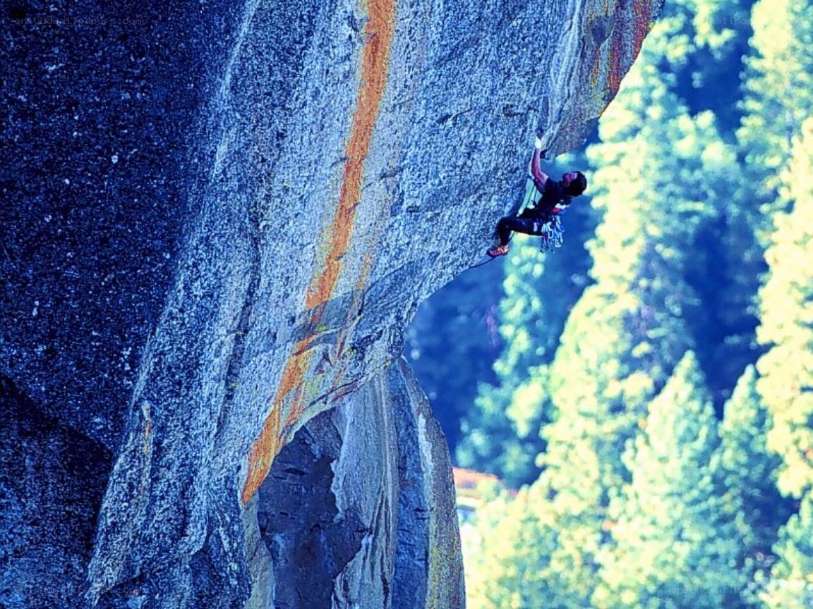 Climber on a steep rock face