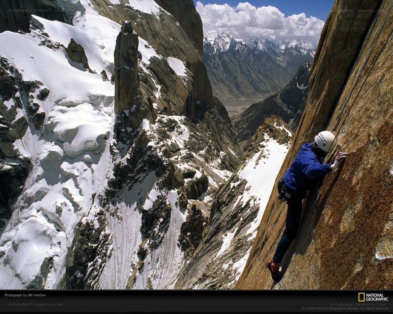 Climber on a steep rock face
