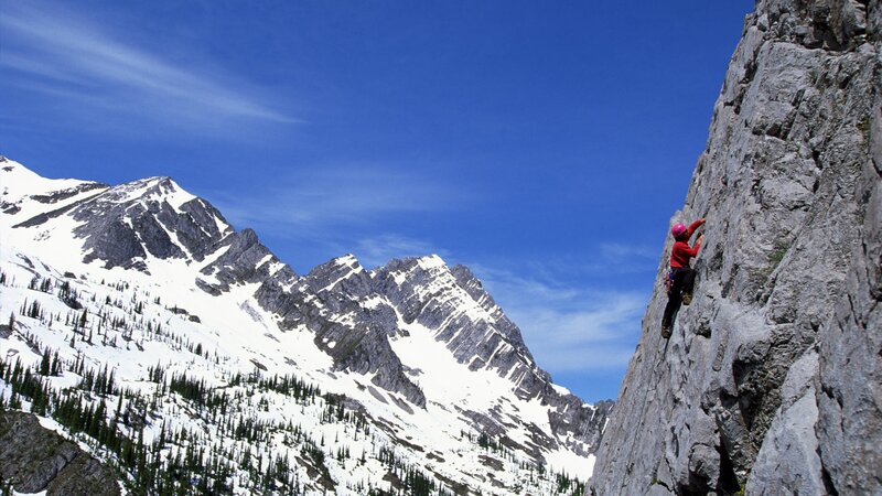 Climber on a steep rock face