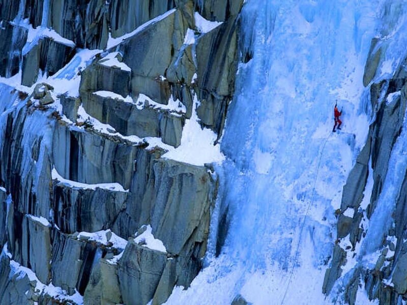 Climber on an icy cliff