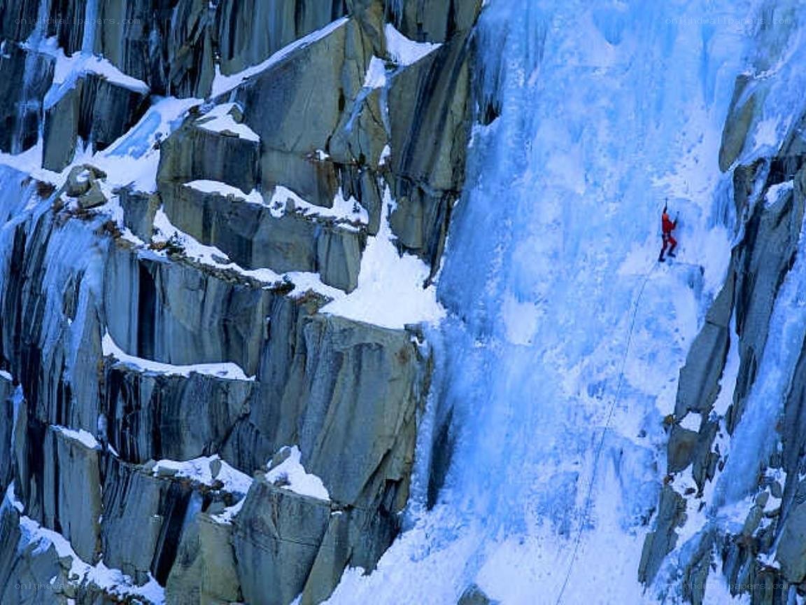 Climber on an icy cliff