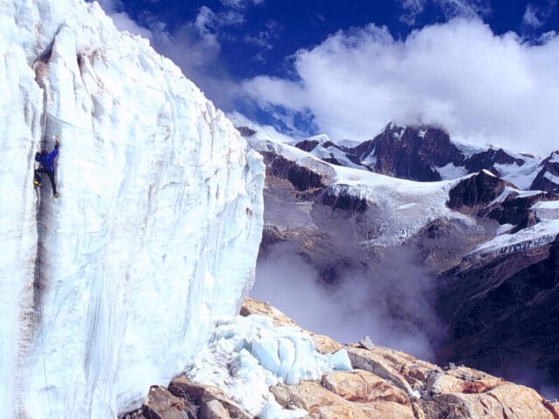 Climber on Ice Wall — White, Dramatic