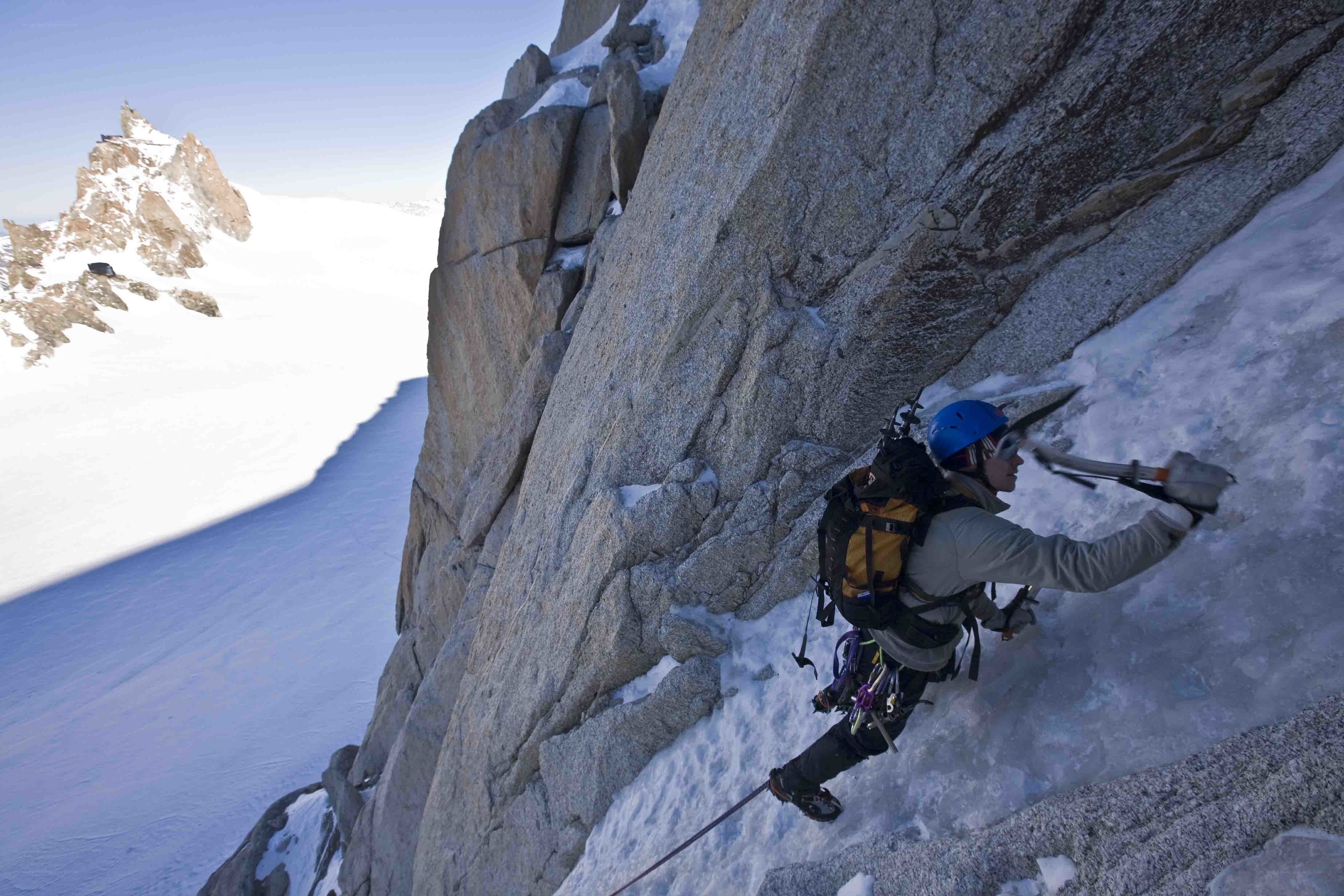 Climber on icy mountain