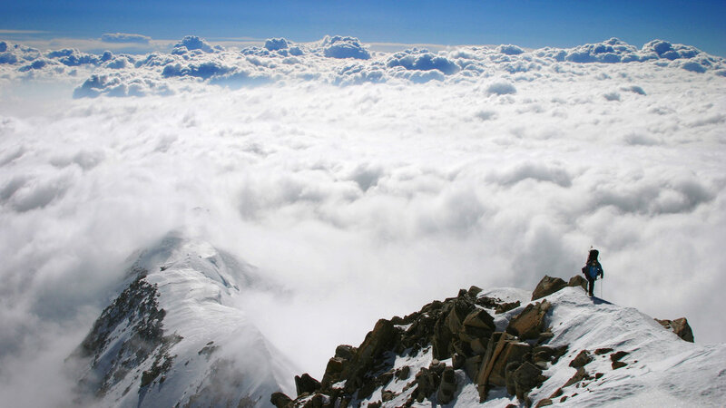 Climber on Mountain Peak — Blue, Dramatic