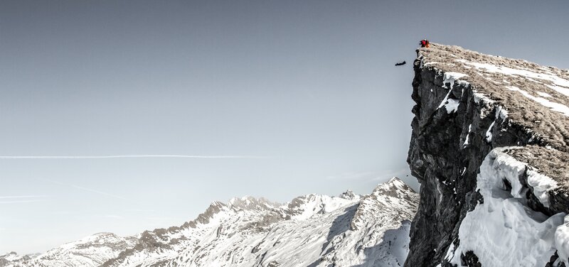 Climber on Mountain Peak — Gray, Dramatic, Winter