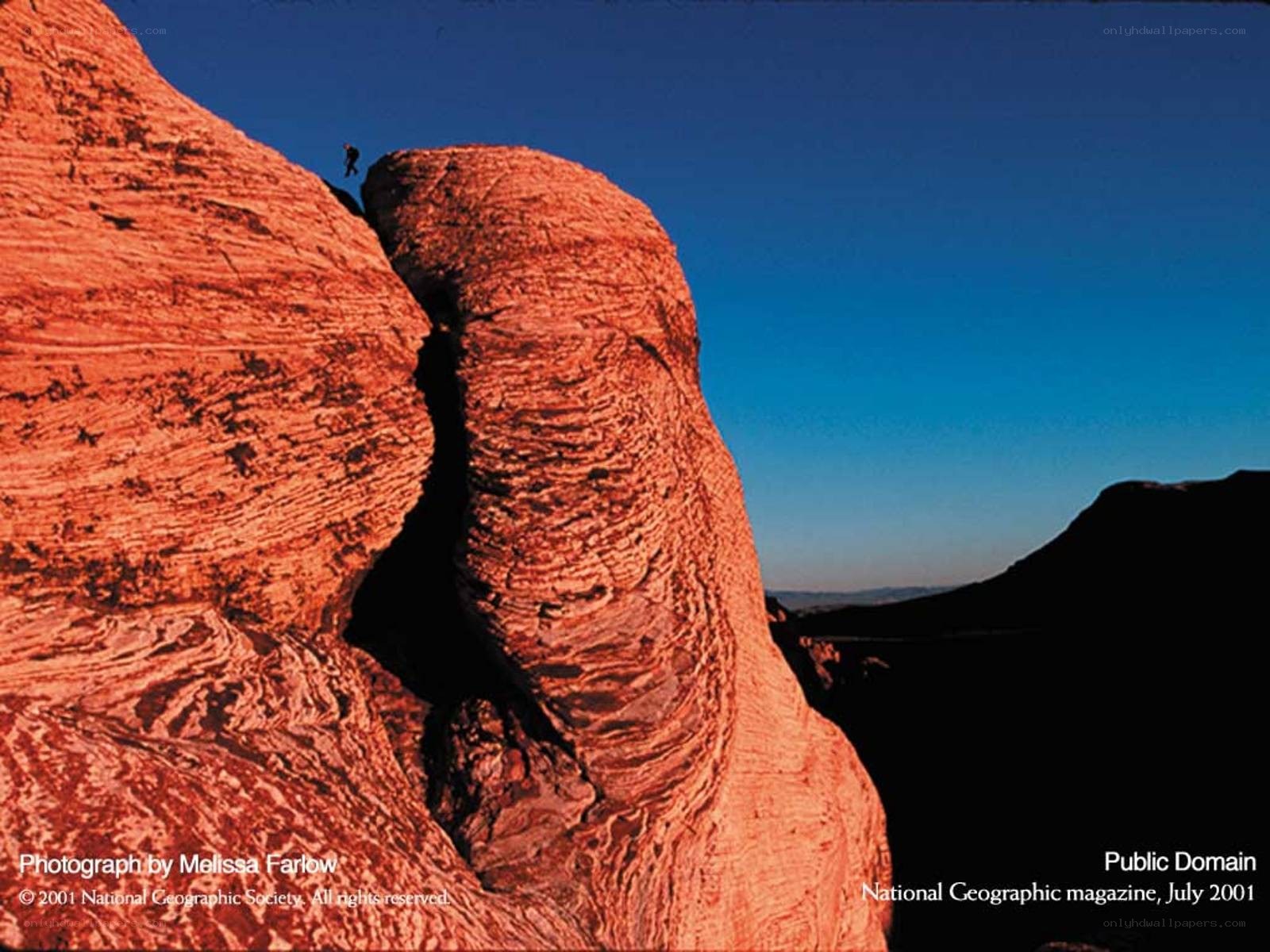 Climber on red rock formation