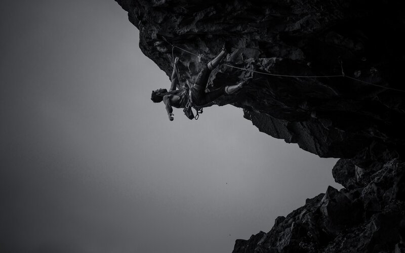 Climber on Rock Face — Black