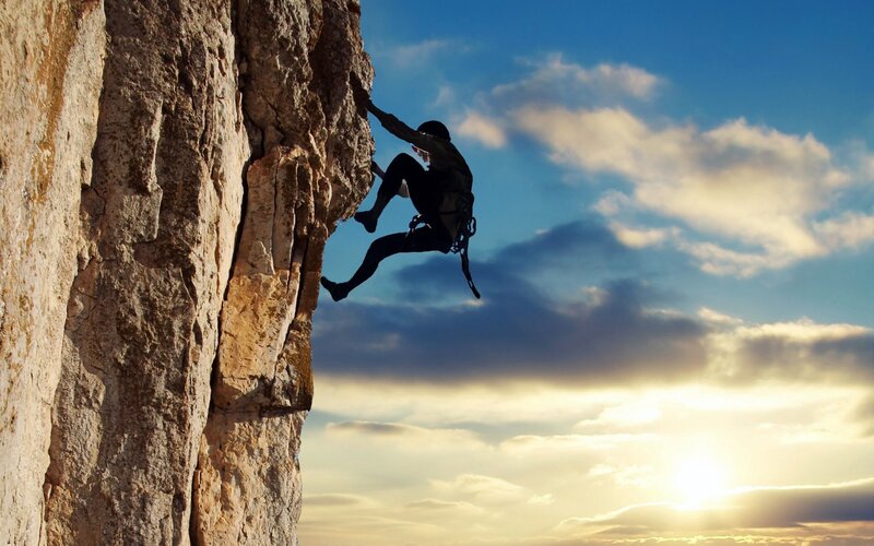 Climber on Rock Face — Blue, Dramatic, Sunset, Photograph