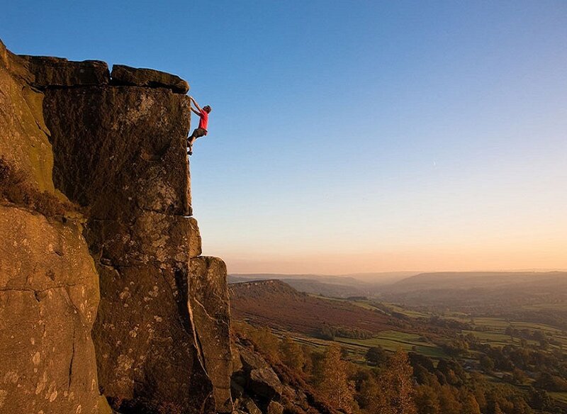 Climber on Rock Face — Blue, Dramatic