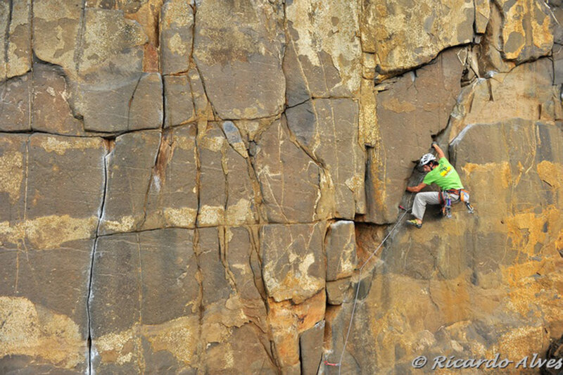 Climber on Rock Face — Brown, Dramatic
