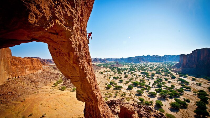 Climber on Rock Face — Red