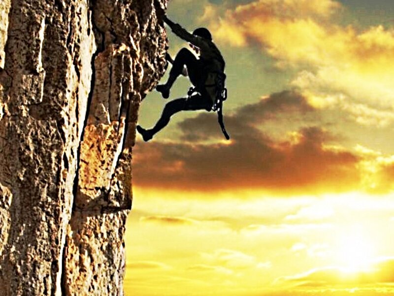 Climber on Rock Face — Yellow, Dramatic, Sunset, Photograph, Sky, Clouds