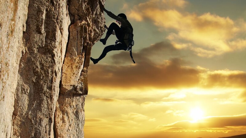 Climber on Rock Face — Yellow, Dramatic, Sunset, Photograph, Sky, Sun