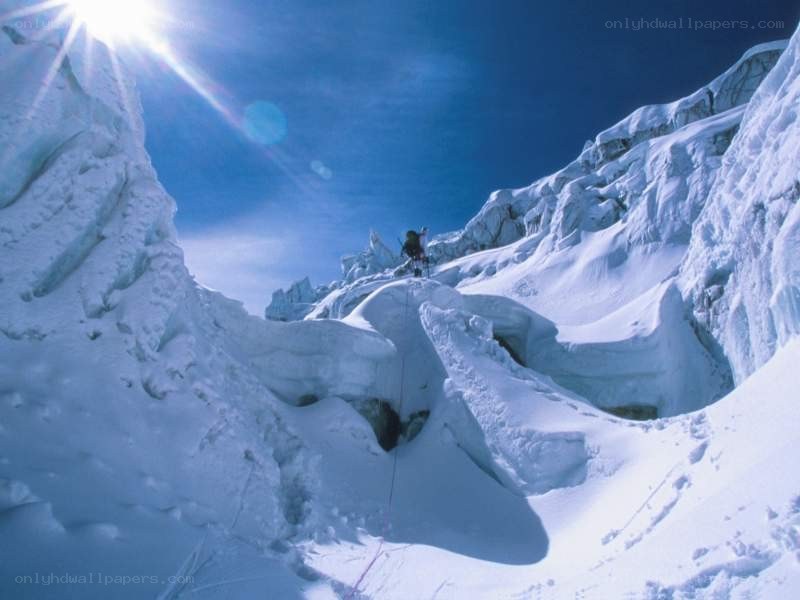 Climber on snowy mountain
