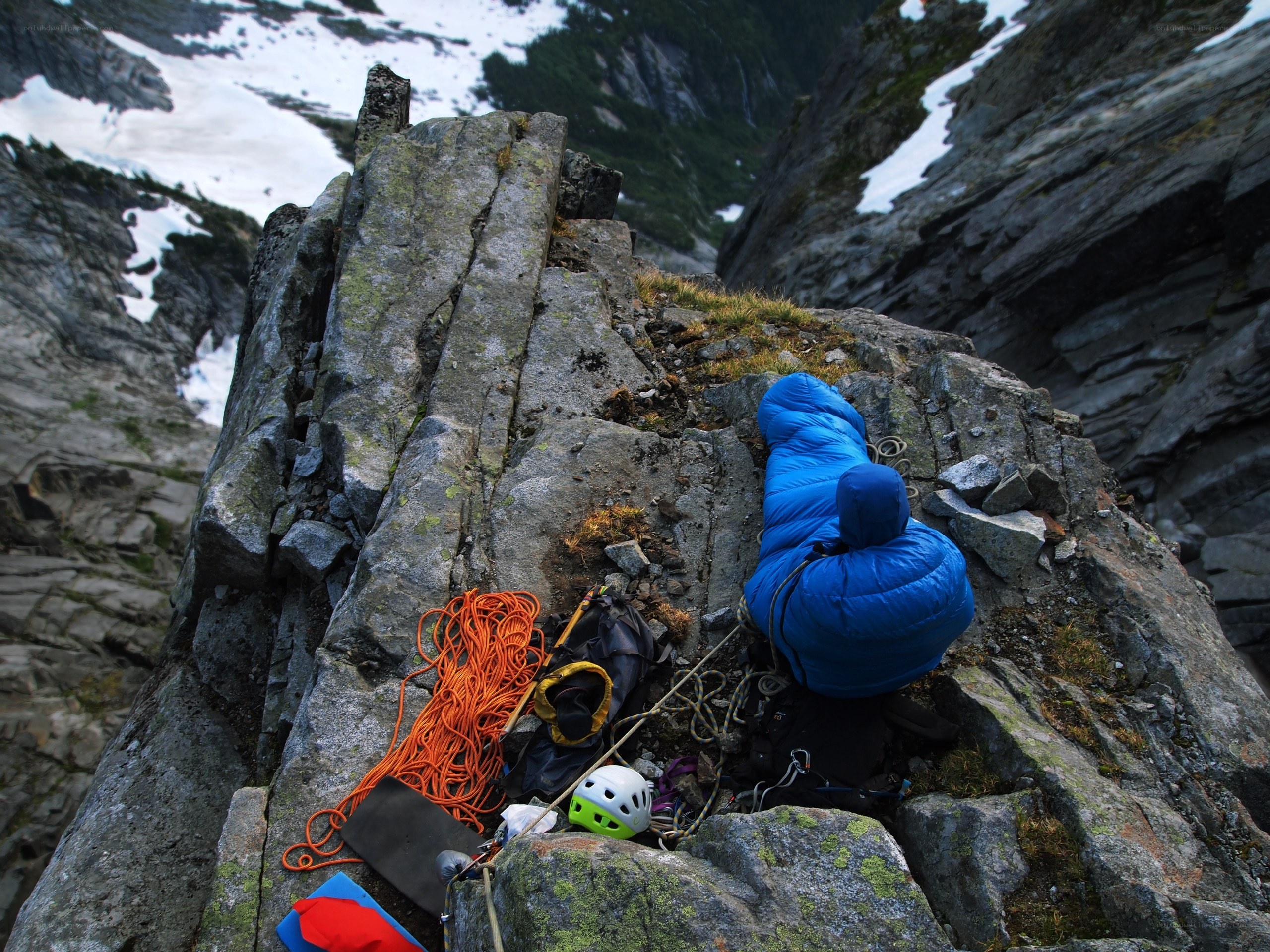 Climber resting on a mountain