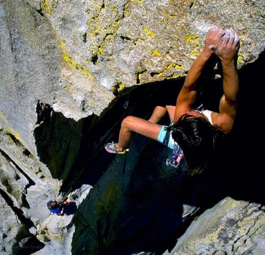 Climber scaling a rock face
