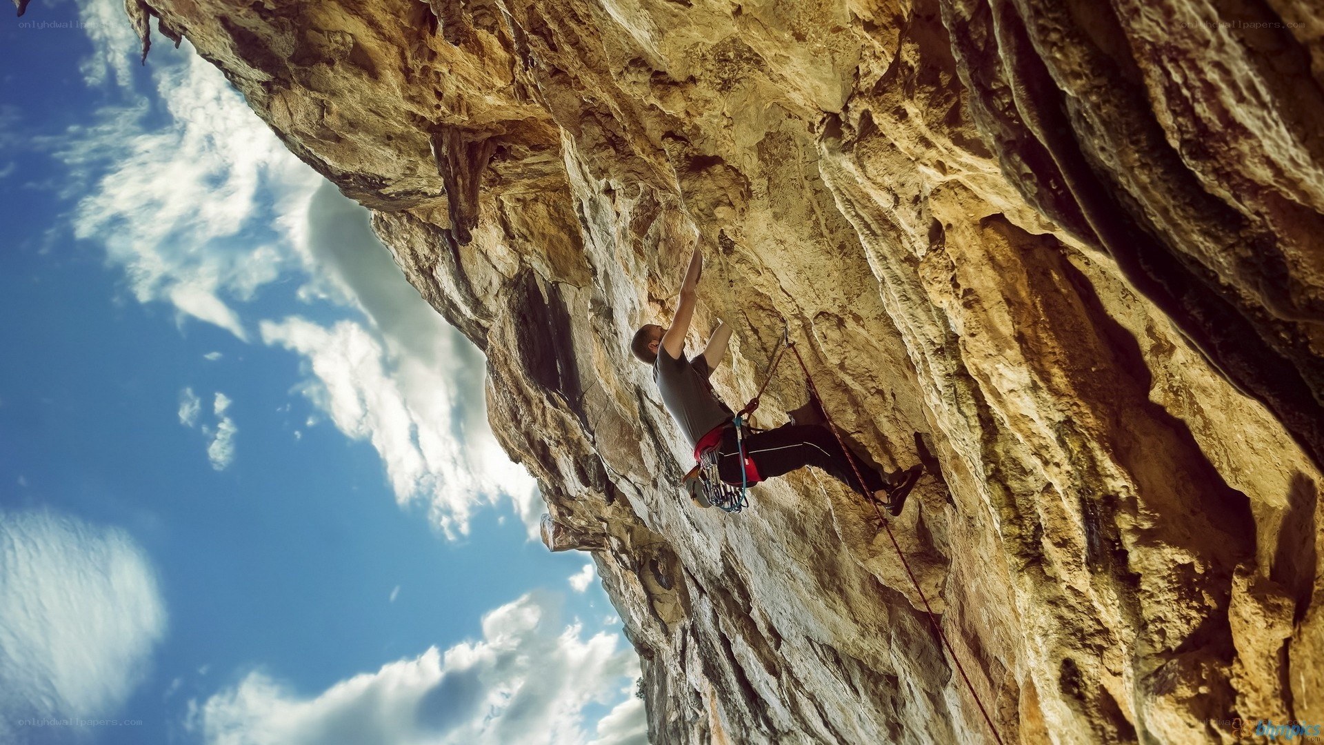 Climber scaling a rock face