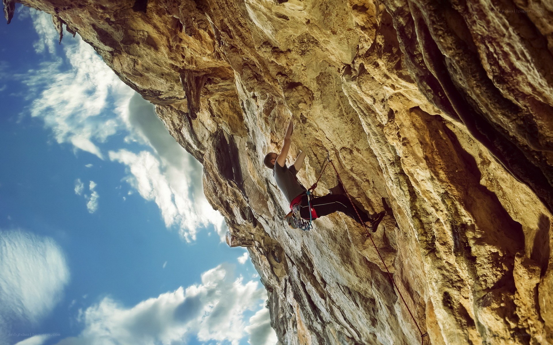 Climber scaling a rock face