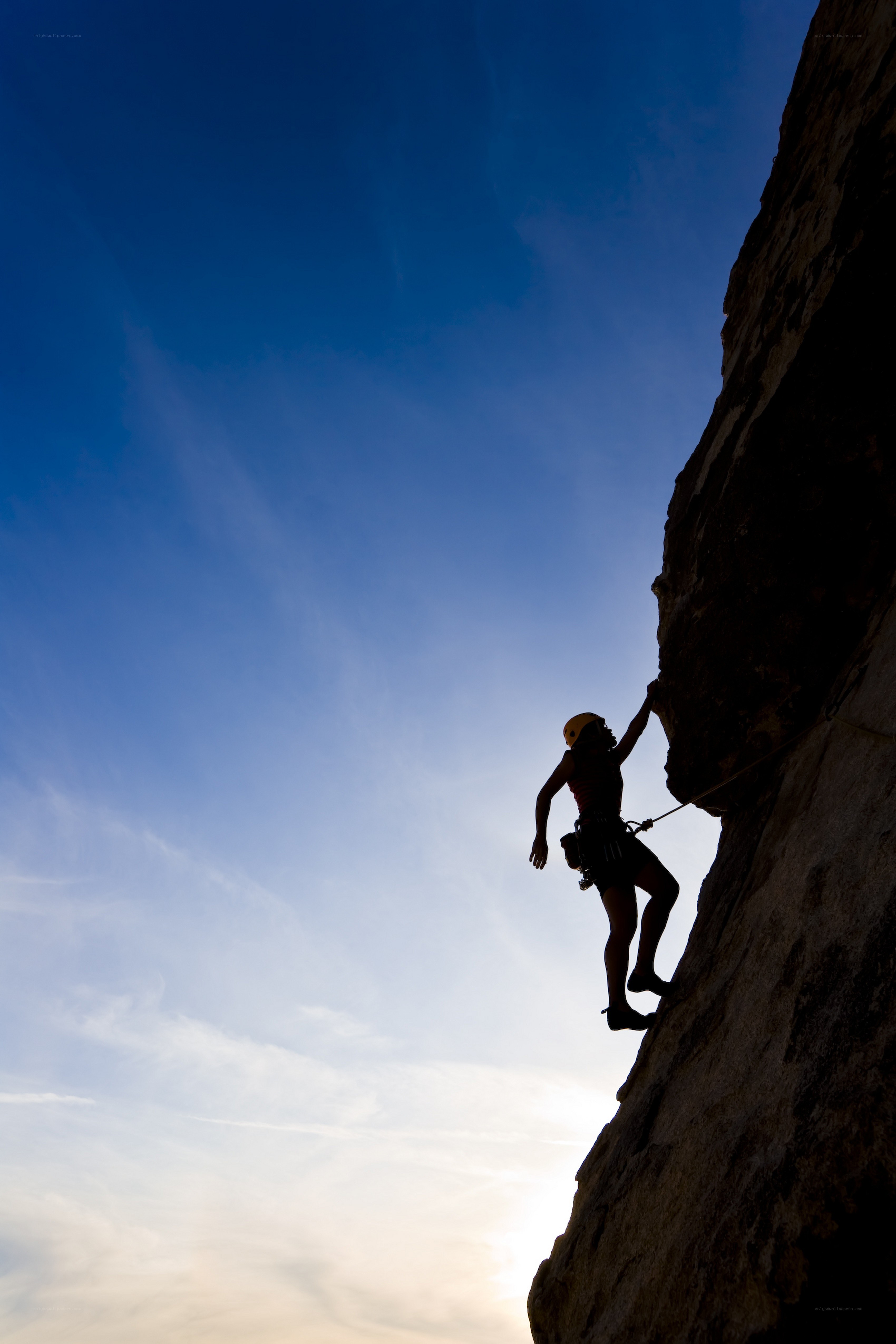 Climber silhouetted against sky