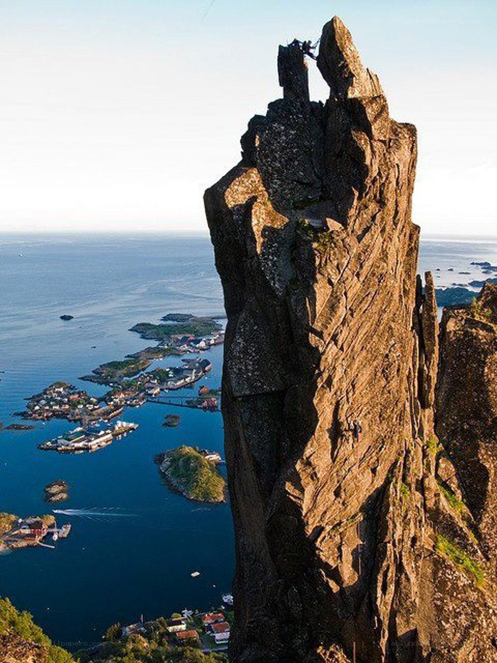 climbers on a sea cliff
