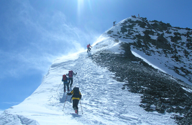 Climbers on a snowy mountain