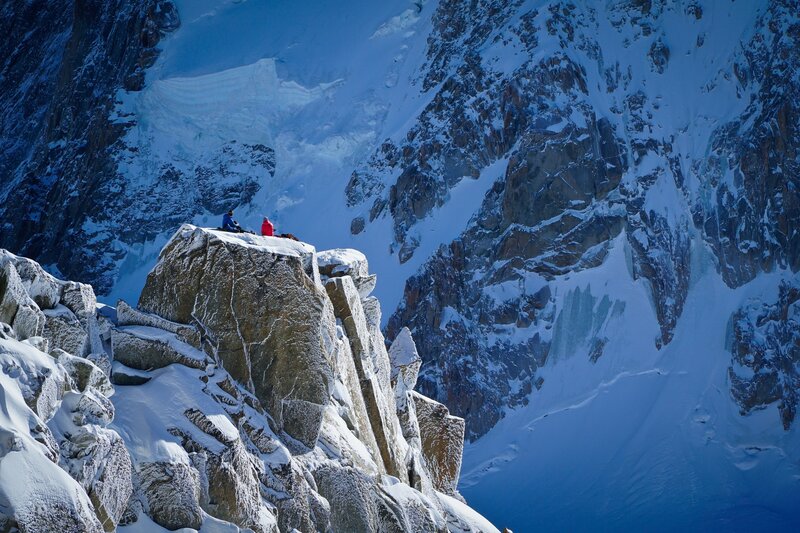 Climbers on a snowy peak