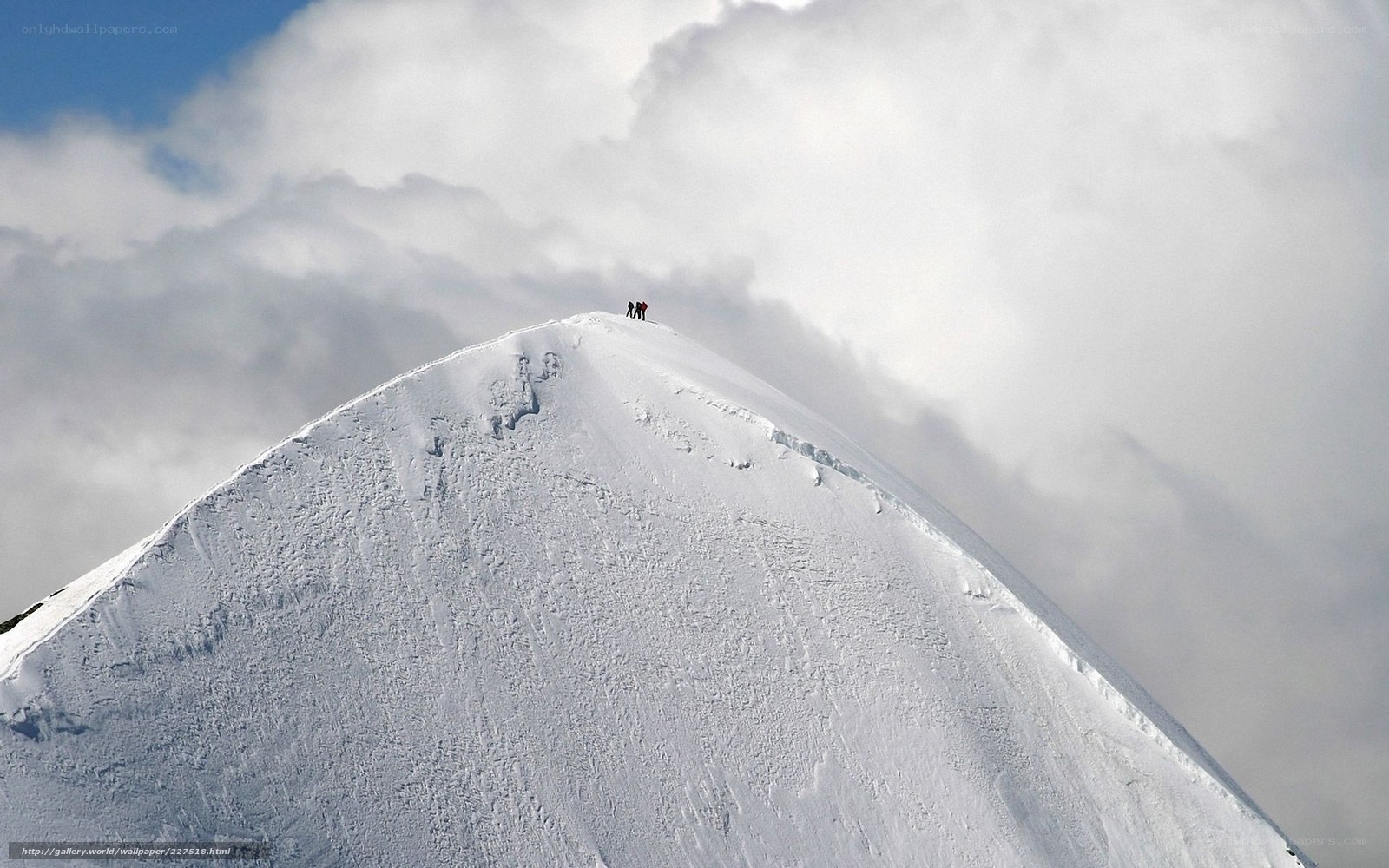 Climbers on a snowy peak