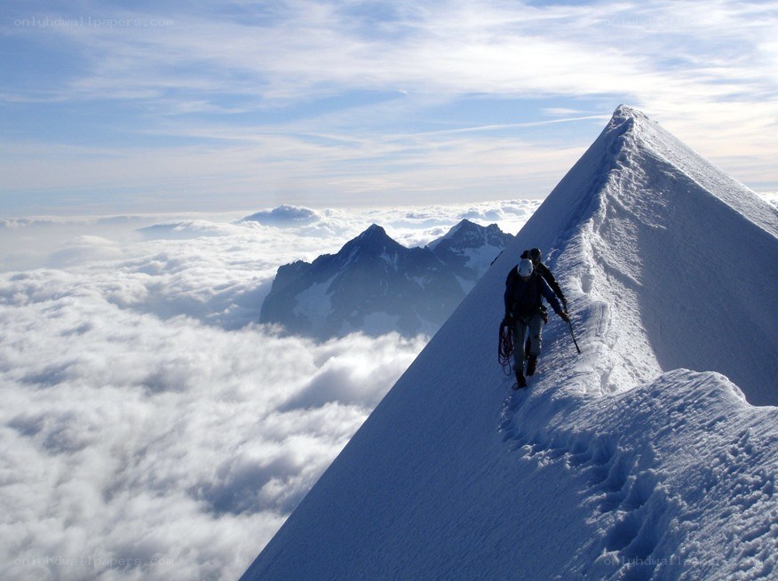 Climbers on a snowy ridge