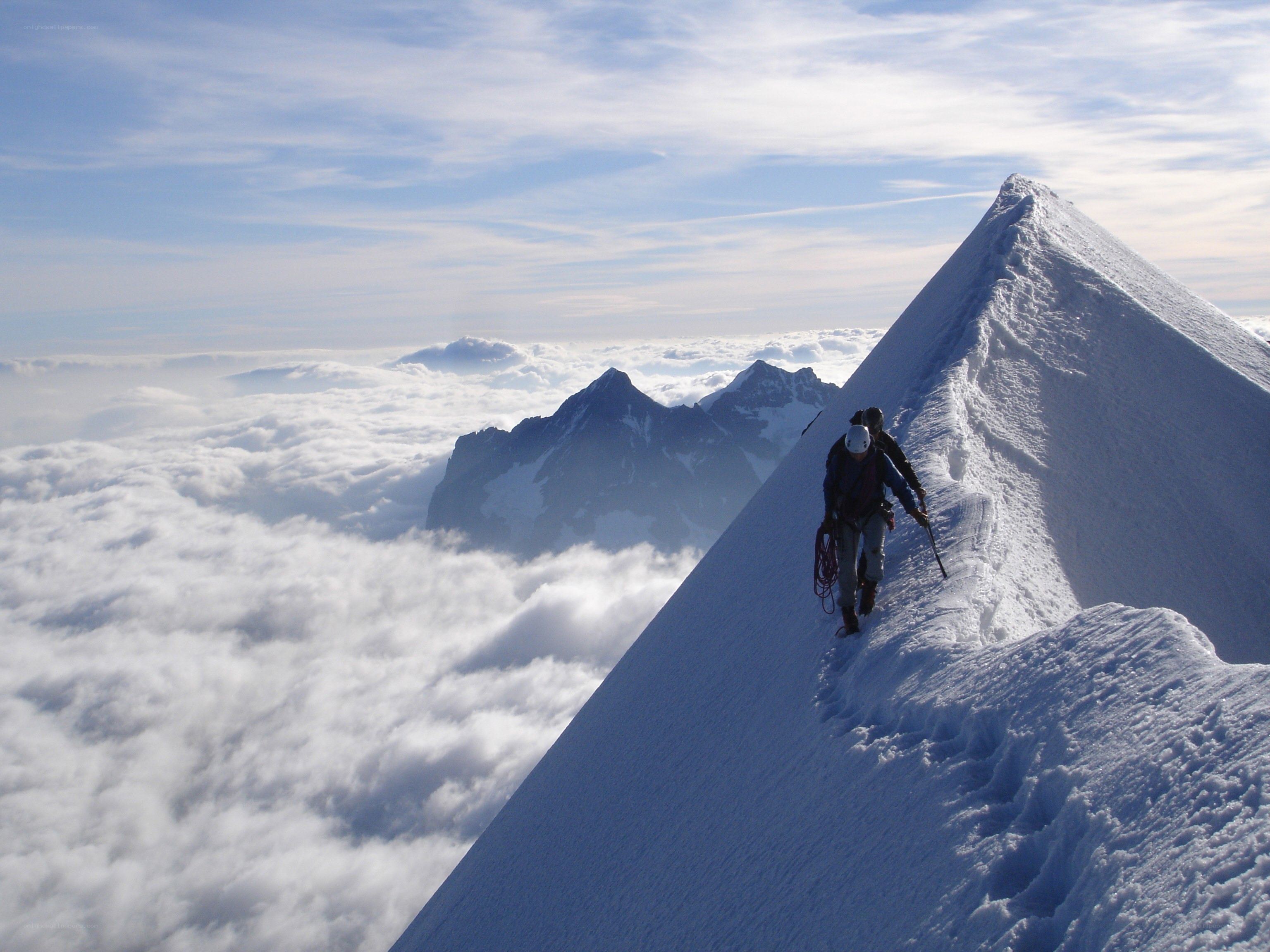 Climbers on a snowy ridge