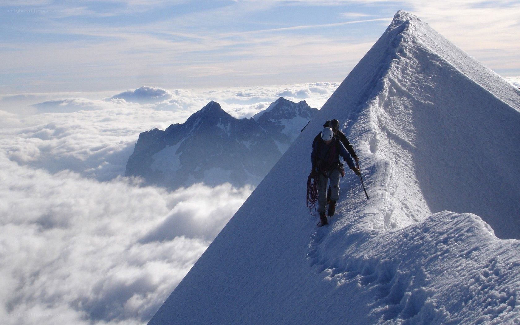 Climbers on a snowy ridge
