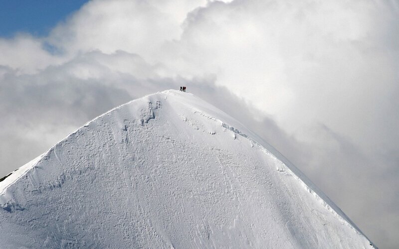 Climbers on Mountain Peak — White