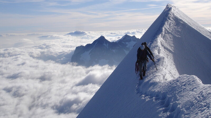 Climbers on Snowy Ridge — White