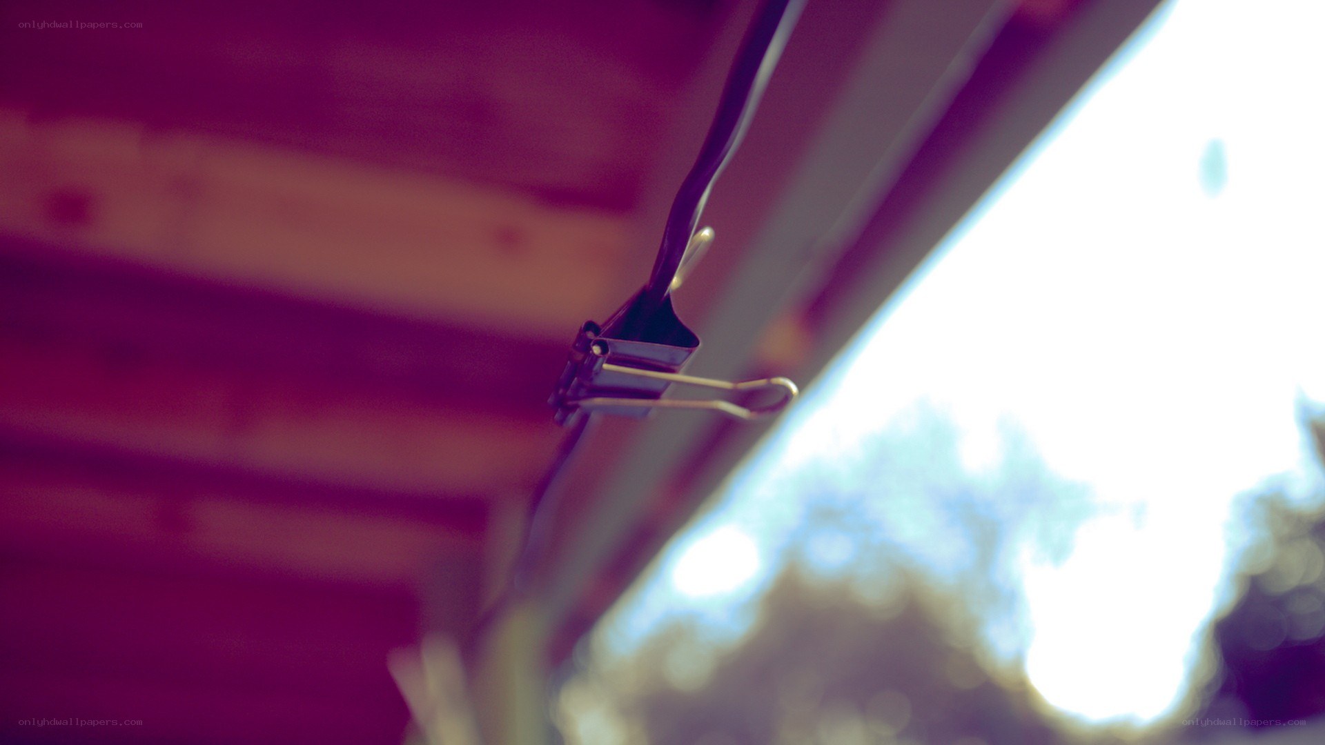 clip holding wire under roof