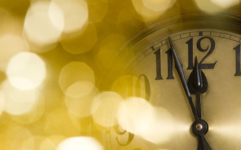 Clock Face with Golden Bokeh