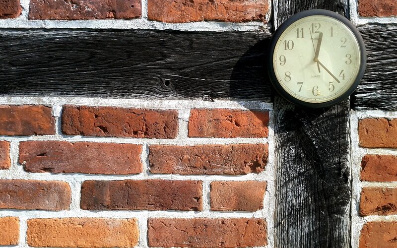 clock on brick wall